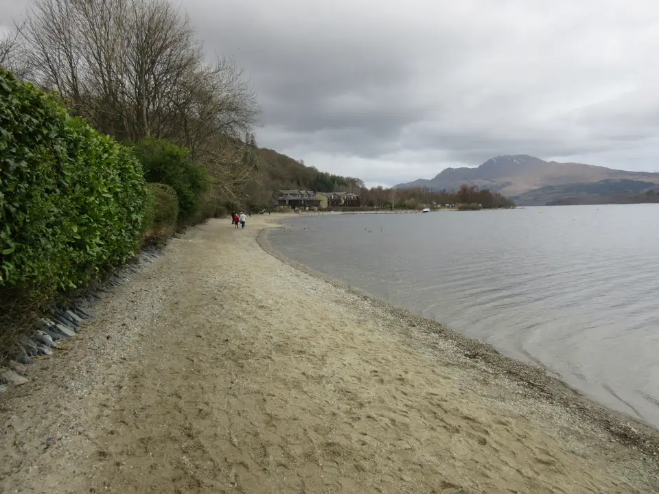 The pebble beach at Luss on Loch Lomond with the water and hills behind