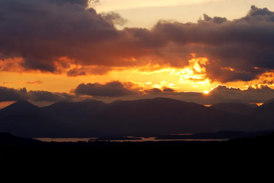 Sunset sky and light over the water of Loch Lomond