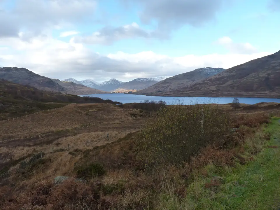 Moorland and a loch with hills beyond in the Trossachs